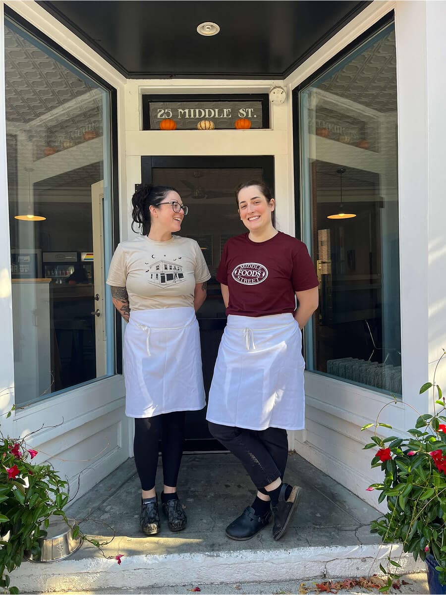 Emma and Melissa in front of Middle Street Foods storefront